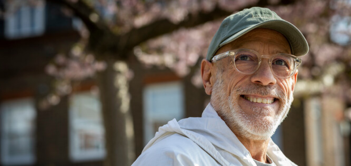 A photo of a man smiling at the camera